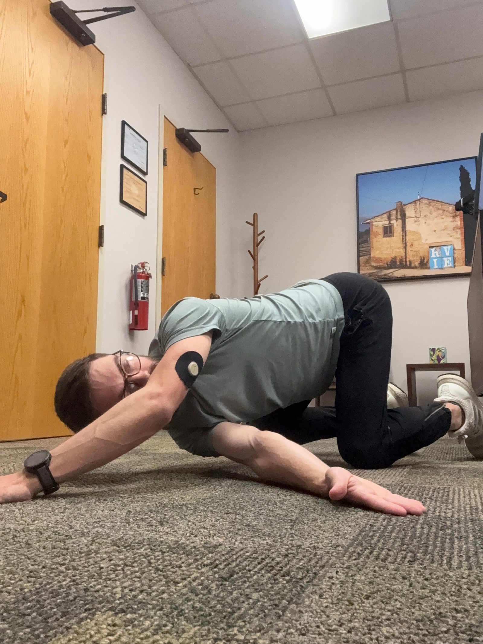 Thread the needle stretch on all fours to loosen a stiff upper back from hunching at a desk