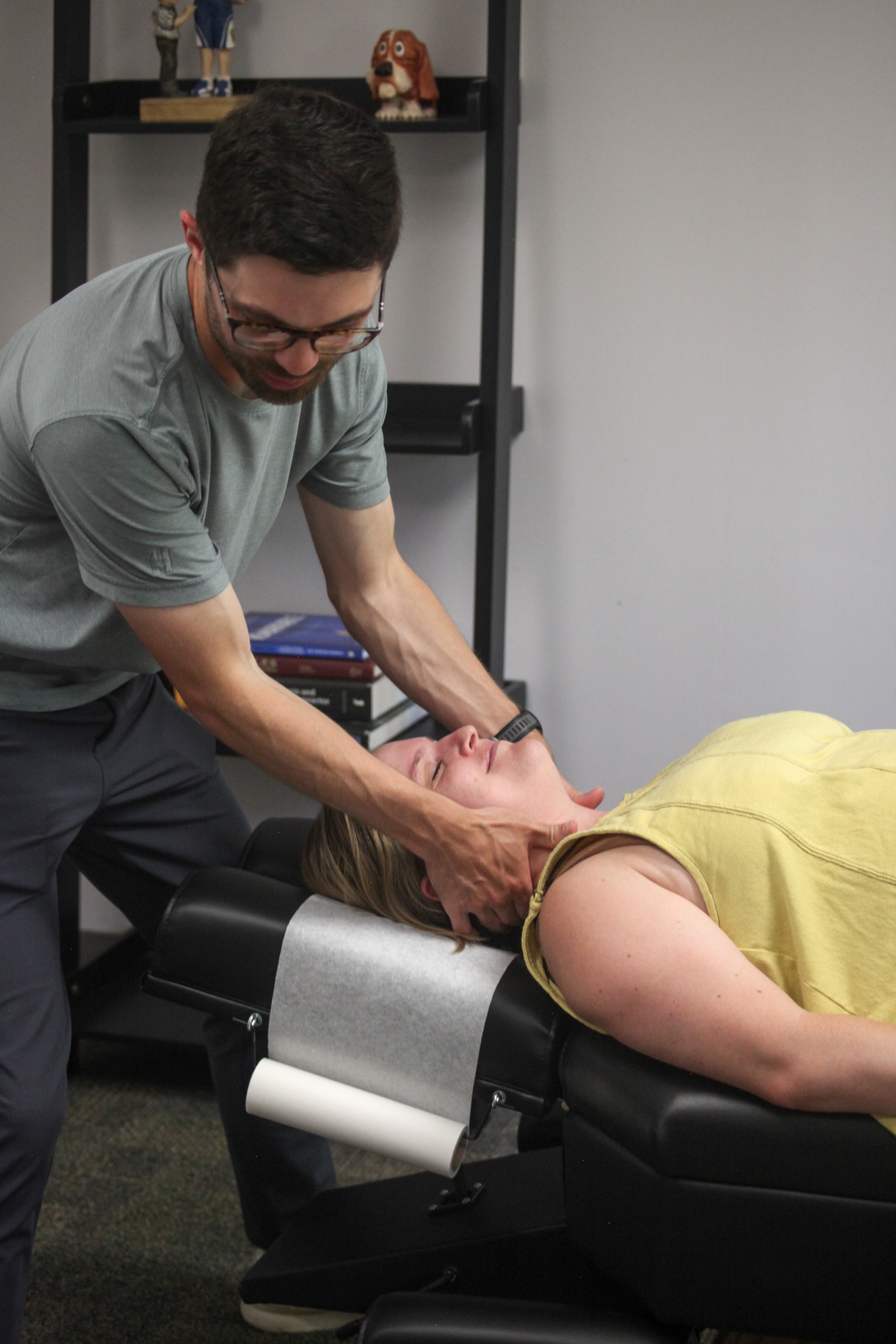 Gentle hands-on care with the patient lying face up, one of the lower-force approaches used with older patients