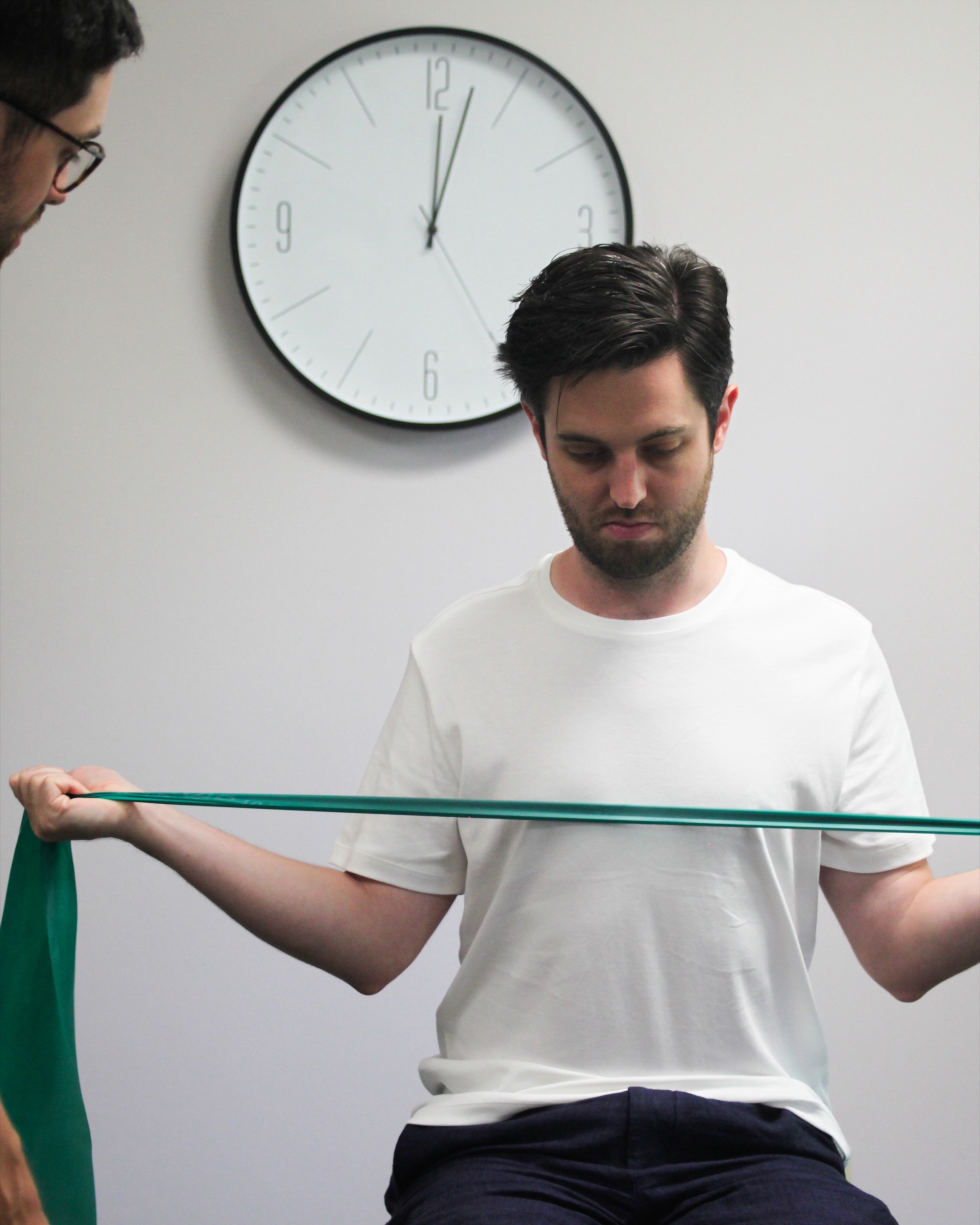 Patient performing guided resistance-band exercises to support the lower back and hips